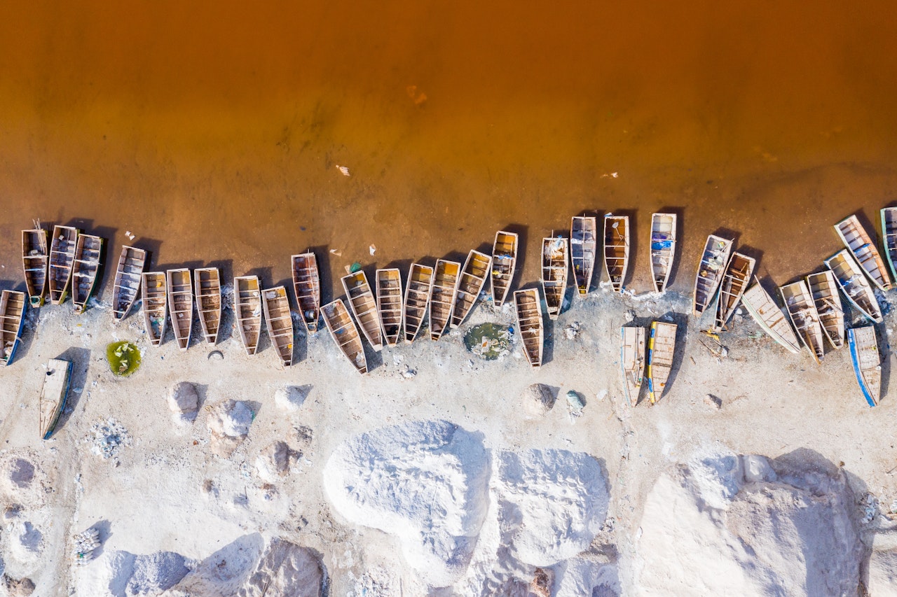 Photo Showing Aerial View Of The Small Boats For Salt Collecting At Pink Lake Retba Senegal Shutterstock 1570960909