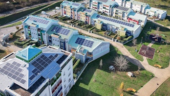 Modern Buildings With Solar Panels On The Roof Italy Shutterstock 2083613173