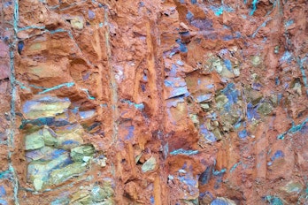 the photo depicts a not focused on the surface of nickel ore saprolite in open pit mines