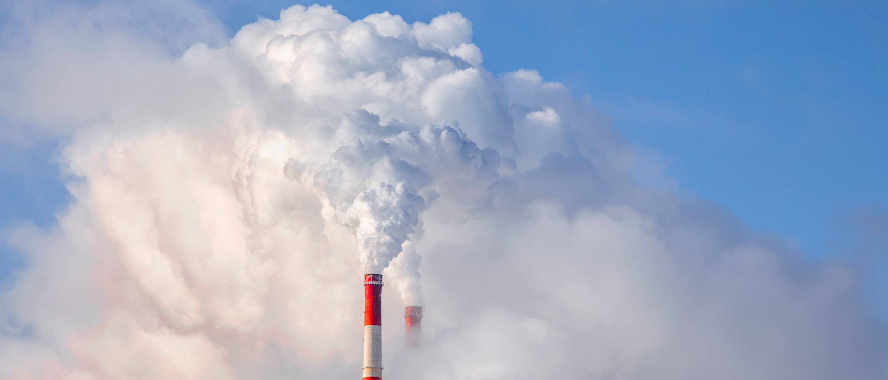 Photo Depicting Smoke From Chimneys Against Blue Sky Background Shutterstock 1662983170