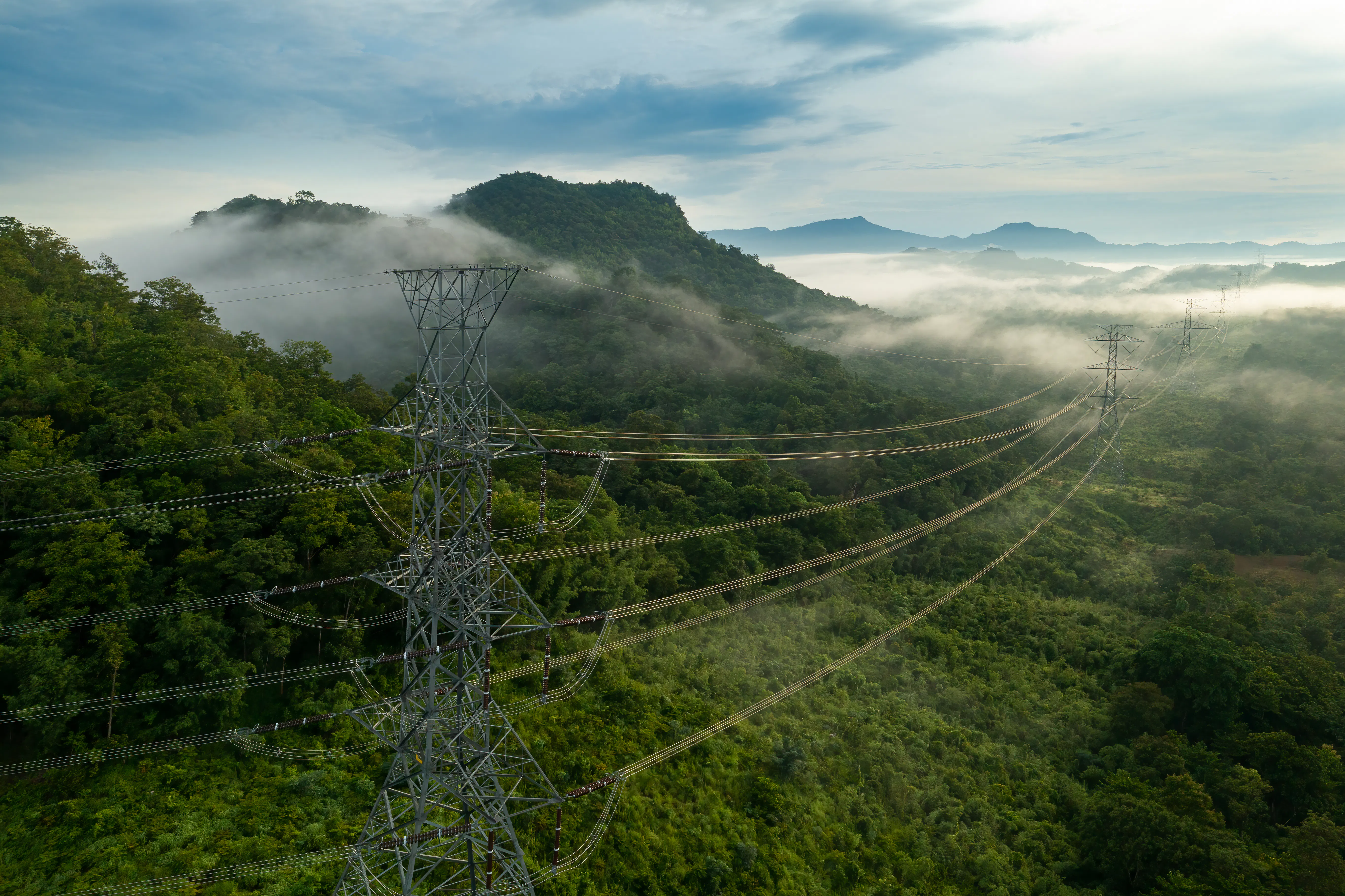Aerial view of morning scenic on high mountains forest with electricity pylon Thailand GettyImages 1401123952