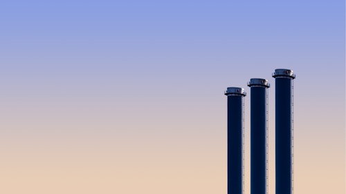 A photograph showing industrial chimneys with a sky background