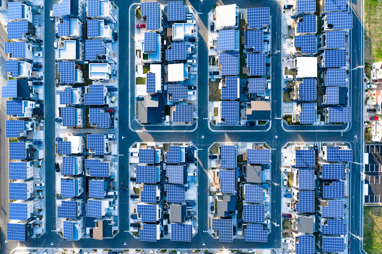 New aerial view of residential area with solar panels