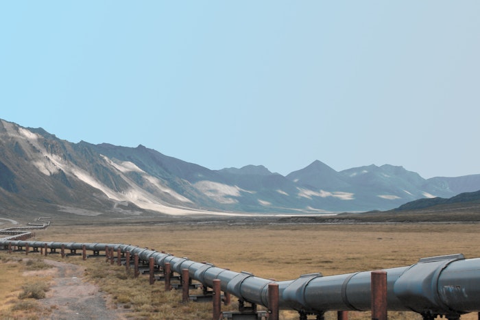 Oil pipeline in front of mountains