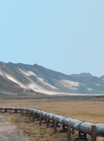 Oil pipeline in front of mountains