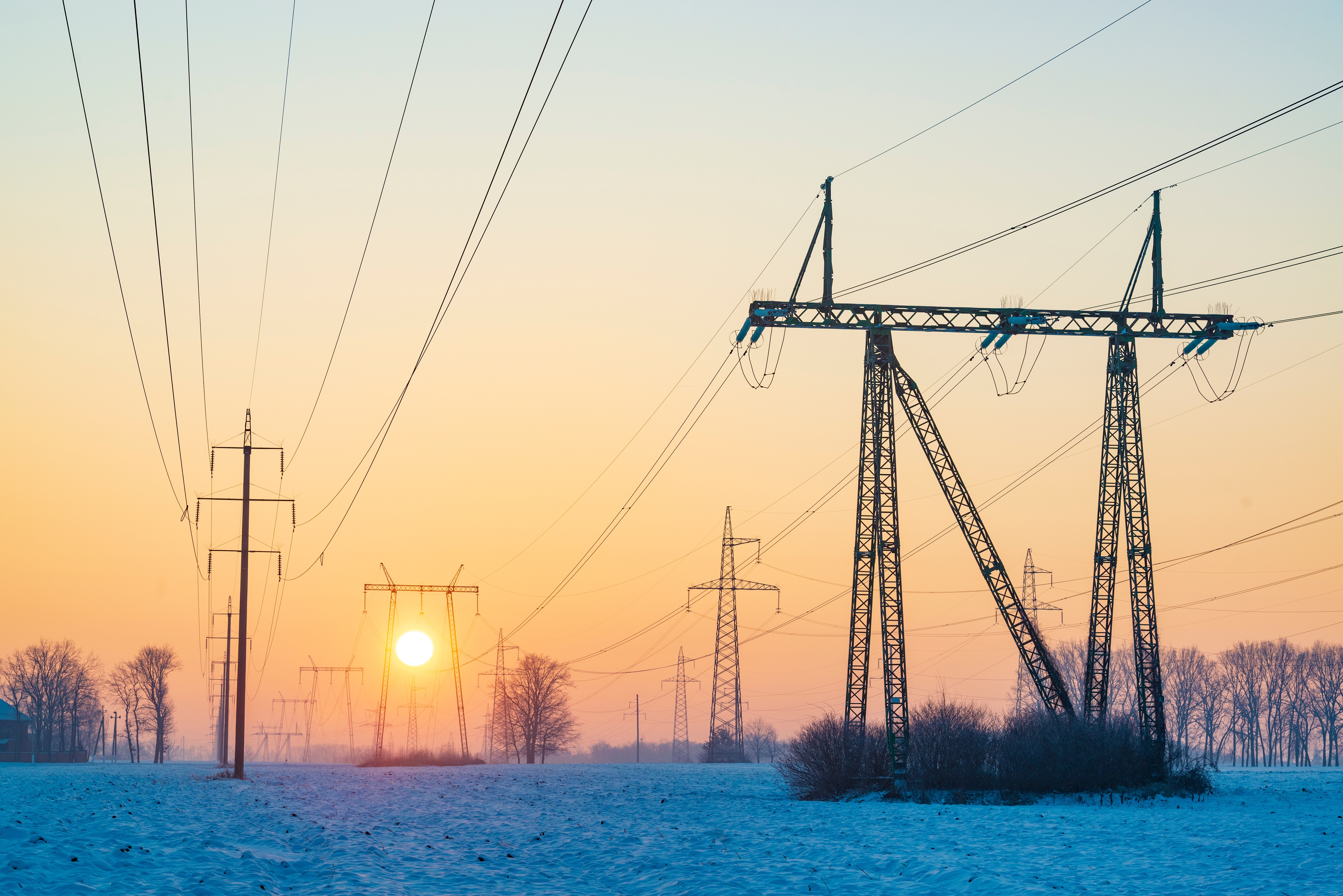 Photo depicts the Ukraine electricity grid in winter time. Power line pylons in cold winter morning. Illustration of blackout risk in Ukraine