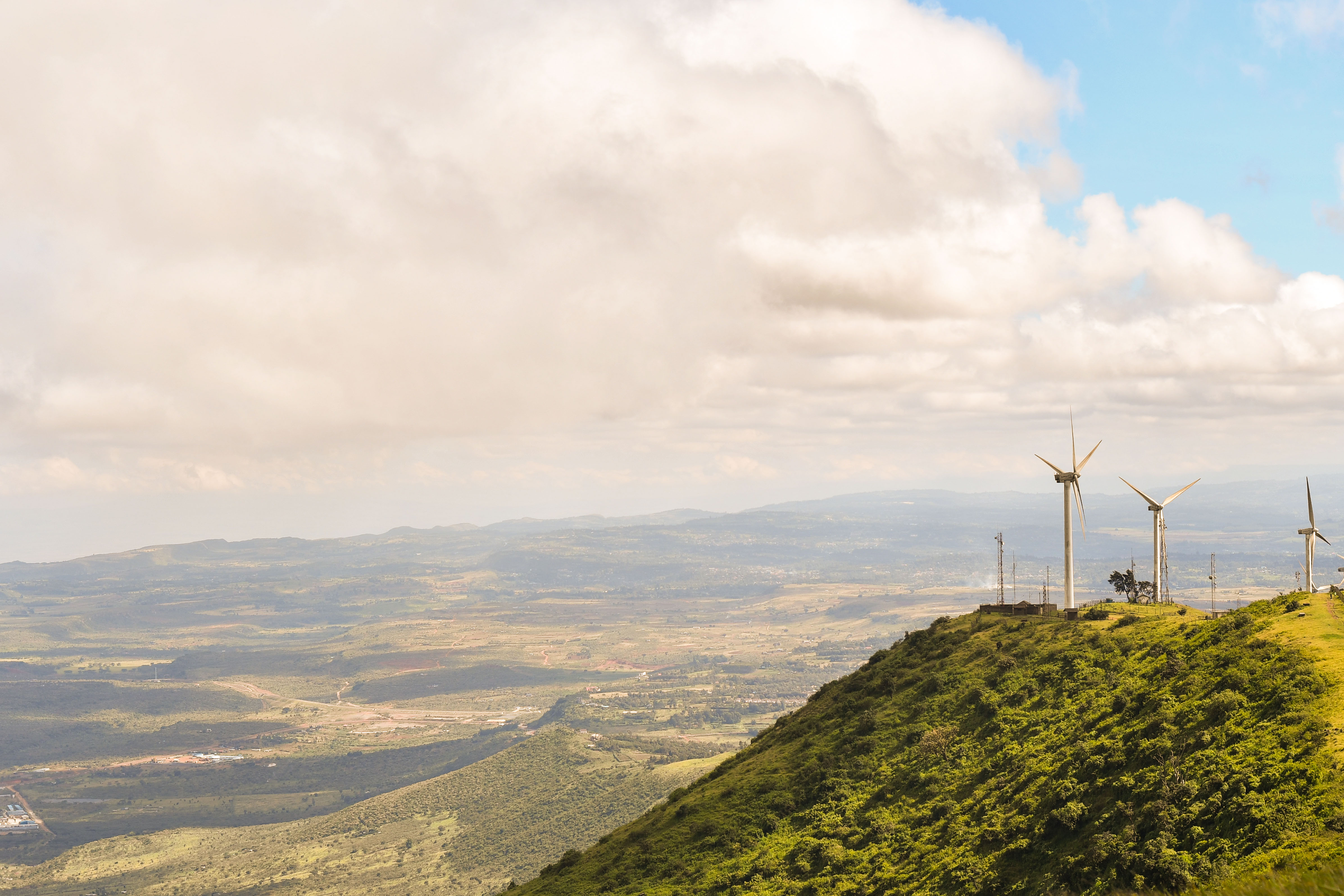 Photo showing wind turbines on a hill with green plantation Kenya  GettyImages 1296664928