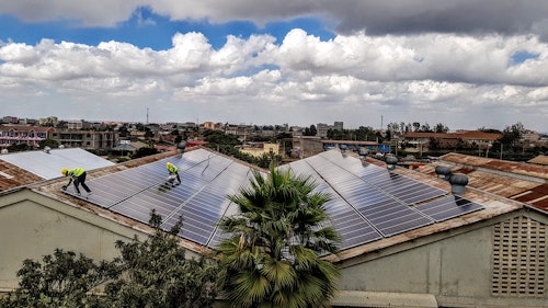 Photo depicts roof mounted solar power plant on a factory roof in Kenya in Africa