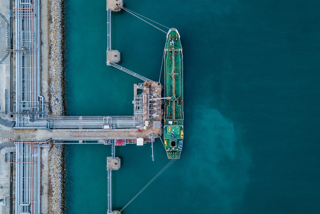 Photo depicts an aerial view oil tanker ship at the port, Import export business logistic and transportation by tanker ship.