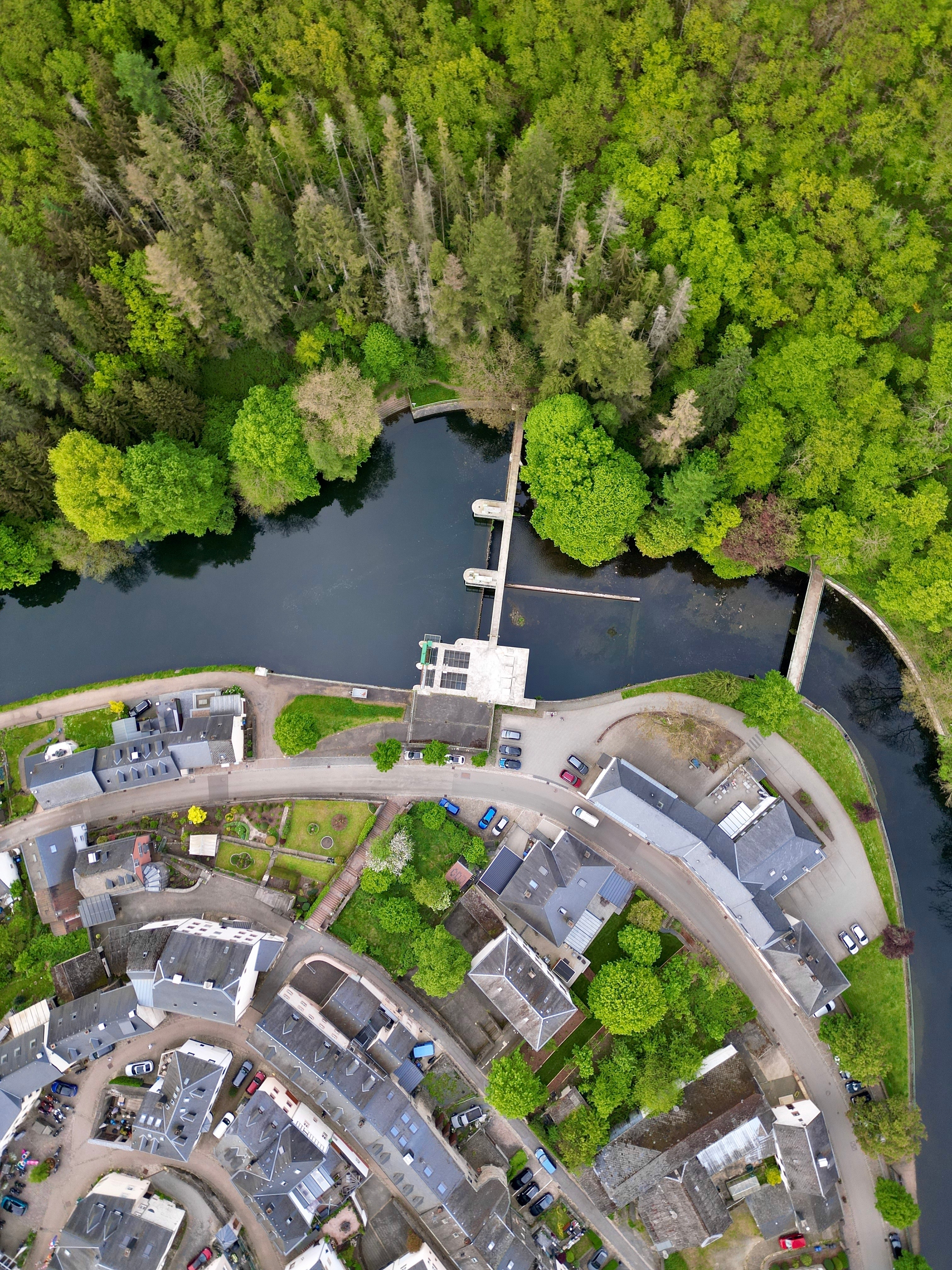 Aerial view of a beautiful village in Luxembourg on the riverbank shutterstock 2470278171