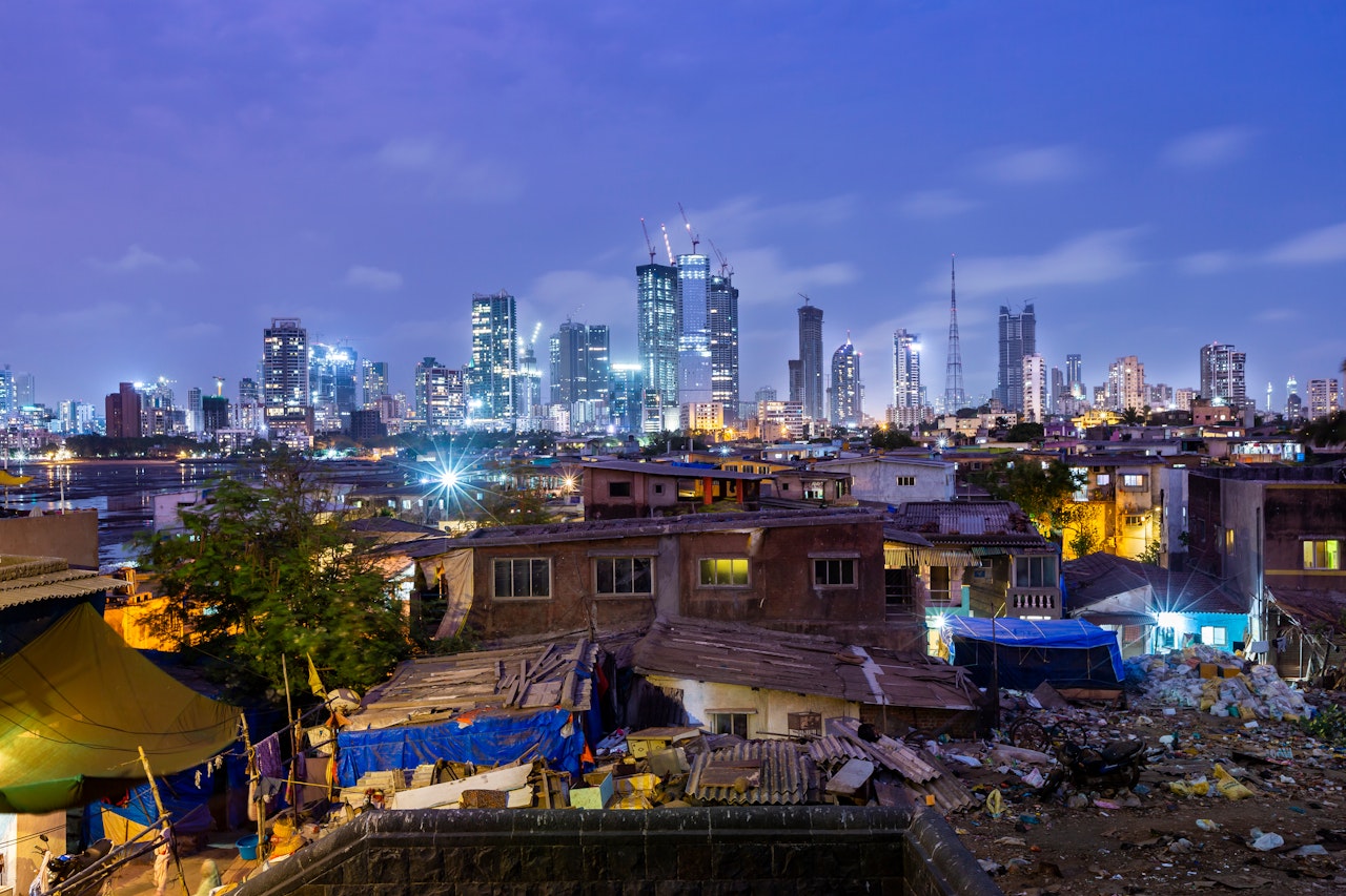 Night skyline of Mumbai photographed from Worli fort with the village in the foreground. Encroachment and development in the same frame.