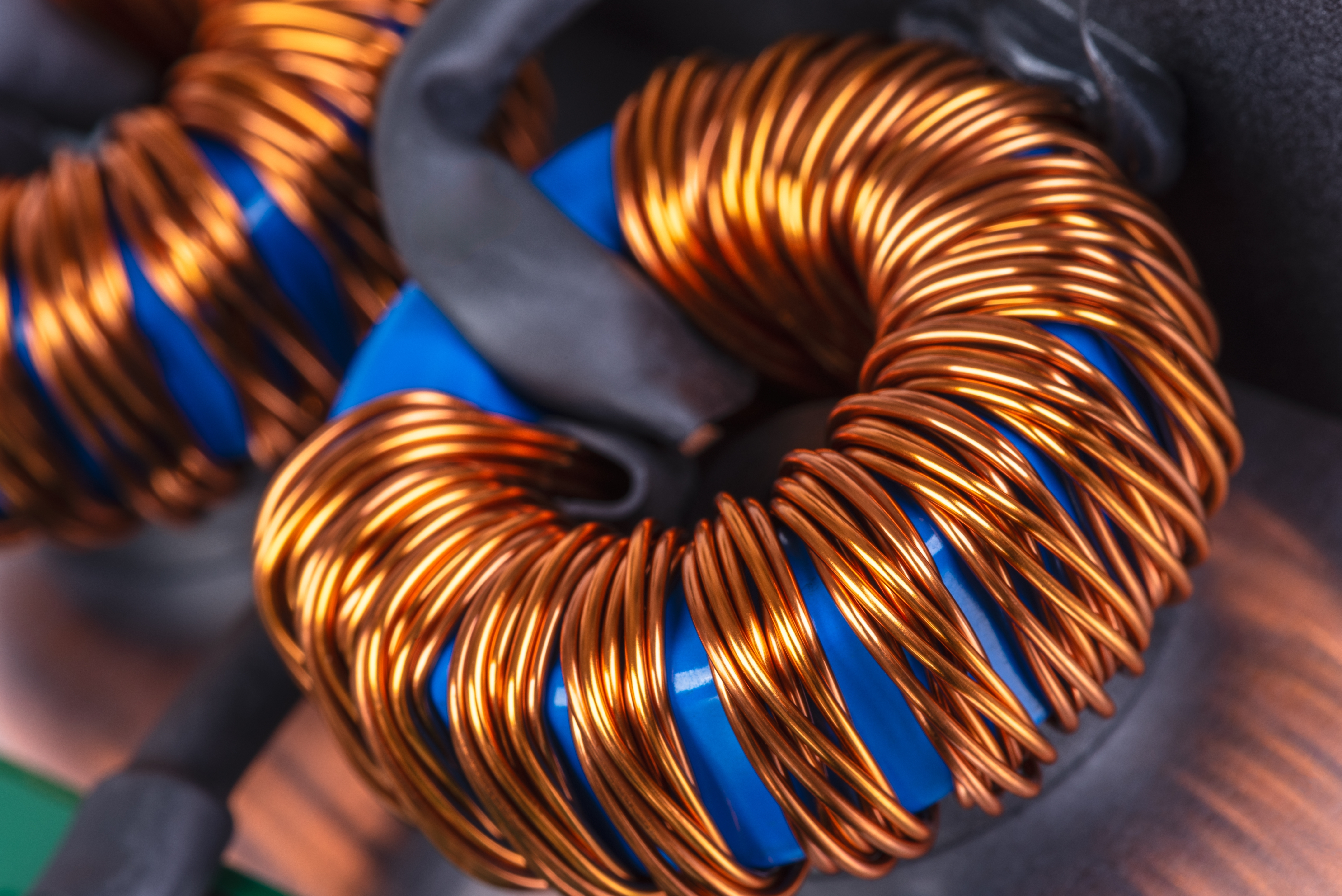 photo depicts Close-up of a copper coil from an electrical transformer