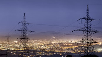 Photo depicts an High power electricity poles in urban area.
