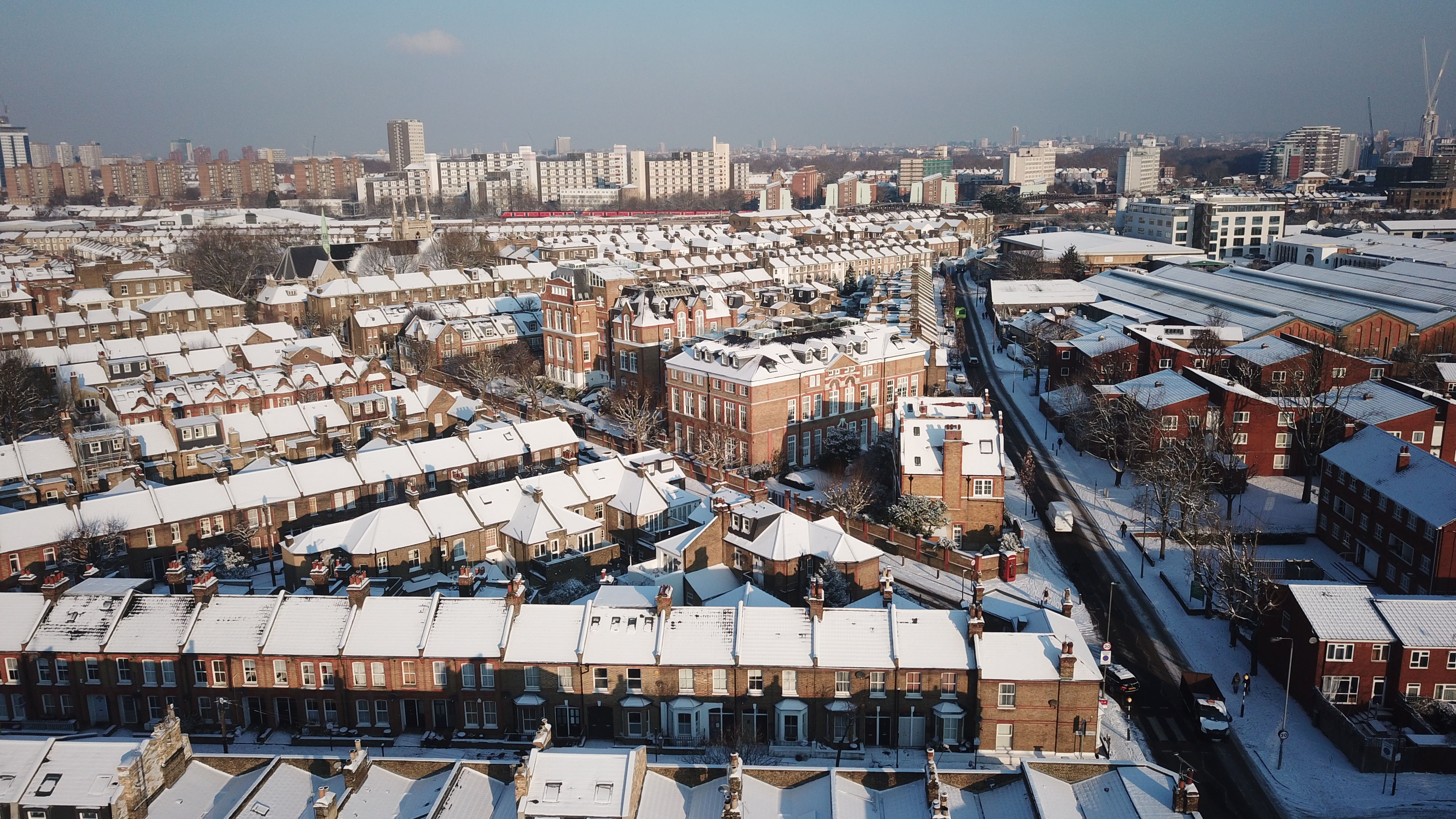 Aerial drone image of London, England after a big snowfall.