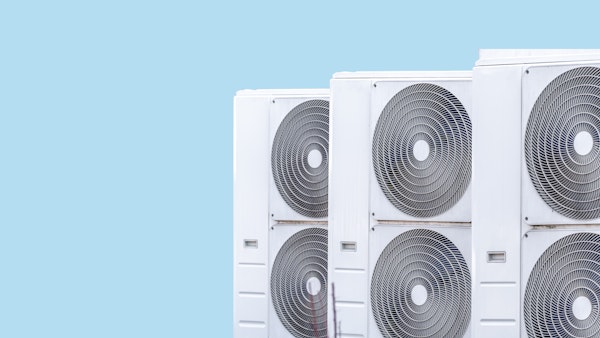 Photo shows three heat pumps on a blue background