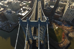 Aerial View Of Manhattan Bridge With Buildings On The Sides Shutterstock 591394799