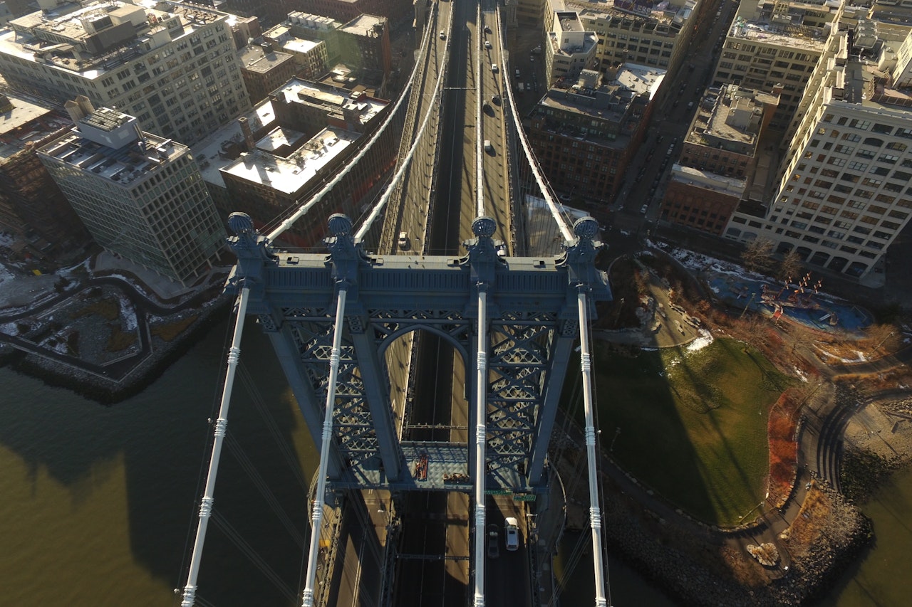 Aerial View Of Manhattan Bridge With Buildings On The Sides Shutterstock 591394799
