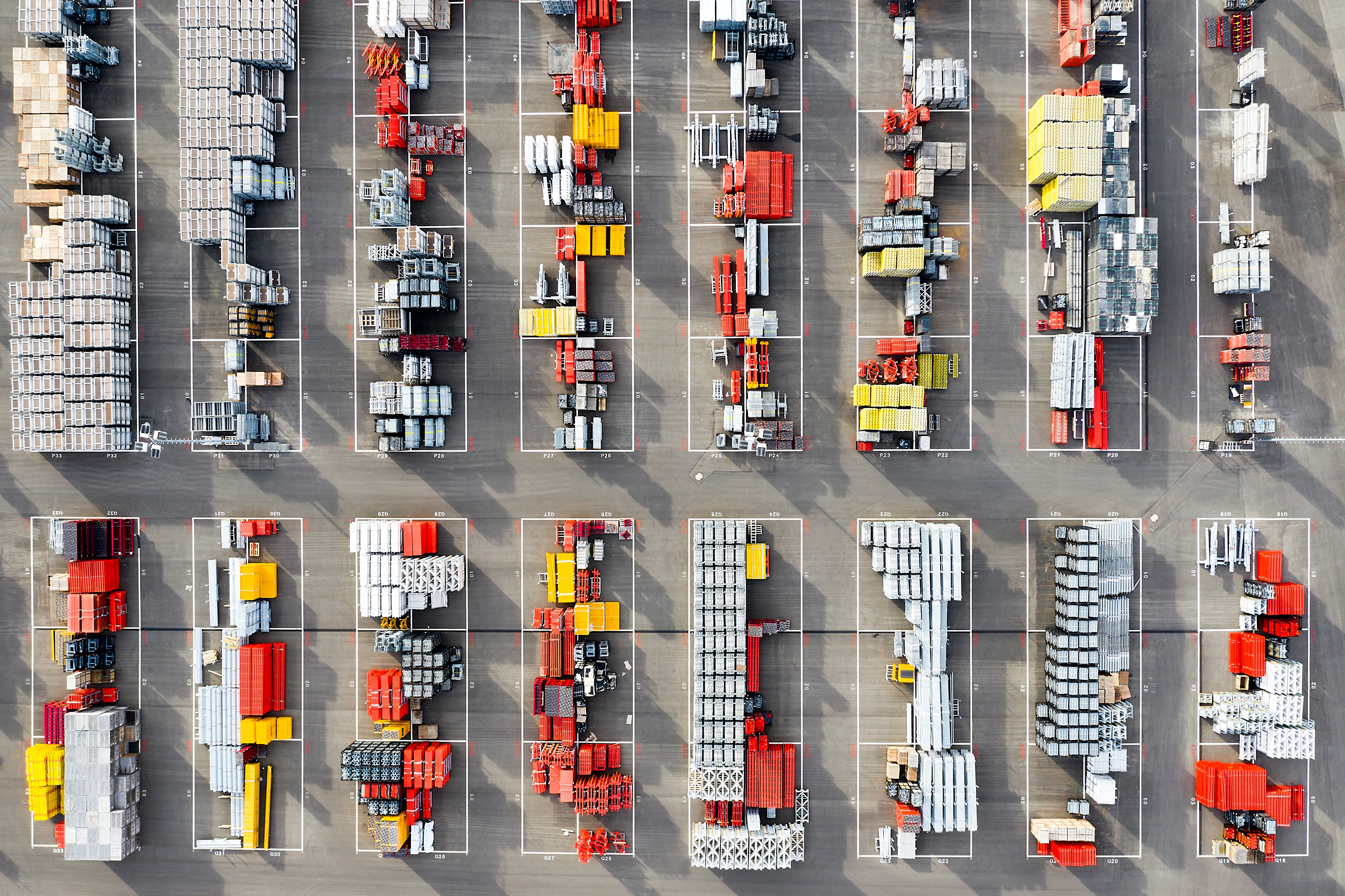 Plastic and metal ware for construction viewed from above at a depot.