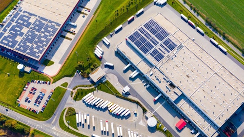 Industrial Warehouses With Solar Panels On The Roof Shutterstock 2211240323 Clean Energy Is Boosting Economic Growth
